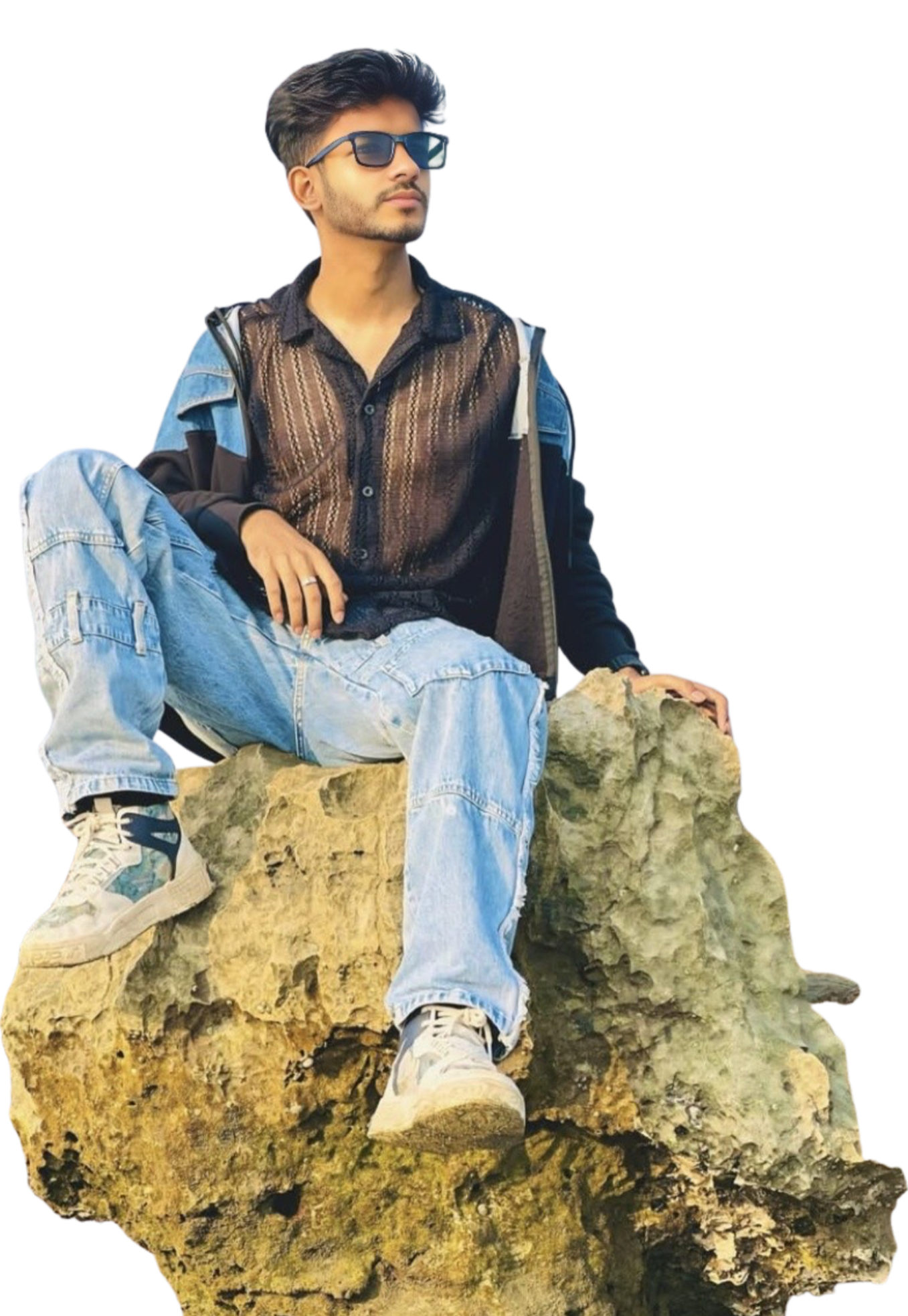 A man in a blue shirt with a happy expression